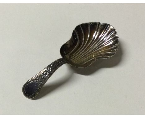 A George III chased silver caddy spoon. Chester. By GB. Approx. 12 grams. Est. £40 - £60.