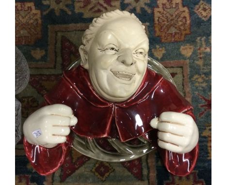 An unusual Austrian glazed lamp mount in the form of a  gargoyle. Est. £20 - £30.