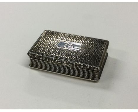 A large engine turned silver snuff box with reeded sides. Birmingham. Approx. 38 grams. Est. £70 - £80.