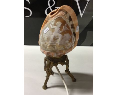An unusual lamp mounted with a cameo on cast base. Est. £40 - £60.