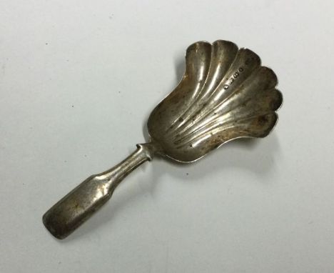A good Victorian silver half fluted caddy spoon. London. By HT. Approx. 8 grams. Est. £10 - £20.