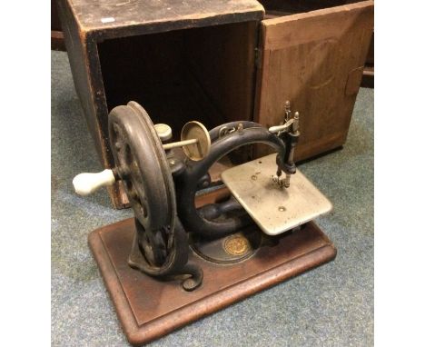 An unusual boxed manual sewing machine. Est. £30 - £50.