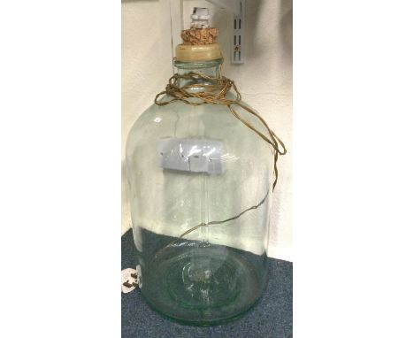 A large glass lamp. Est. £15 - £20.