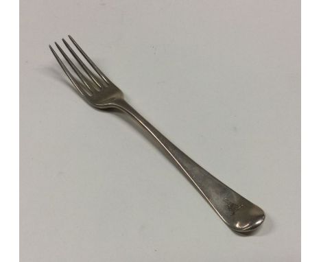 A Georgian silver Hanoverian pattern dessert fork with crested terminal. Approx. 40 grams. Est. £25 - £30.