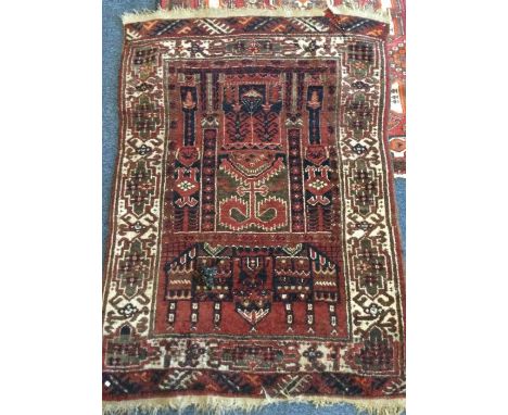 An old tapestry rug. Est. £30 - £50.