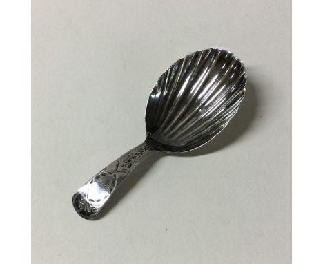 A bright cut silver caddy spoon. London. By GW. Approx. 7 grams. Est. £20 - £30.