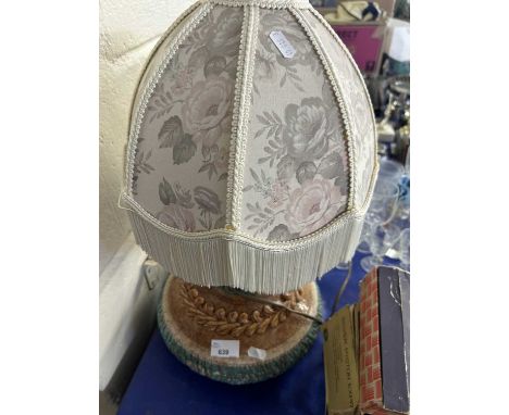 A pottery table lamp with shade