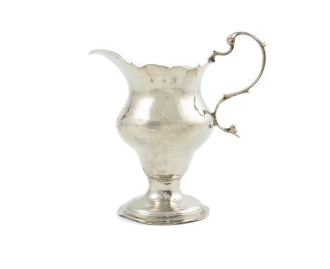 A small Georgian silver cream jug, London 1780, of circular baluster helmet form, on rim foot. 11cm high (4¼'') Provenance: W