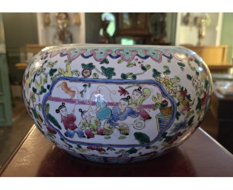 A large Chinese ceramic bowl/ brush washer, decorated with the Famille Rose palate with panels of children at play. Tongzhi (