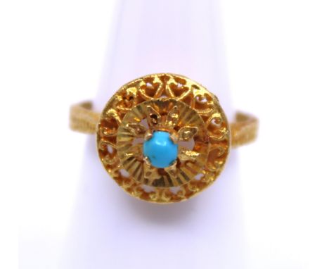 18ct Gold Round Cabochon Turquoise Ring  The ring is unmarked. But has tested as 18ct Gold.  The ring contains a Round Caboch