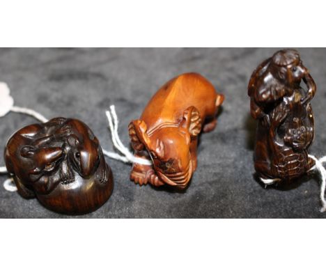 Three modern Japanese carved wood netsuke modelled as a baby elephant, signed,5.5cm long, a netsuke modelled as two rats on a