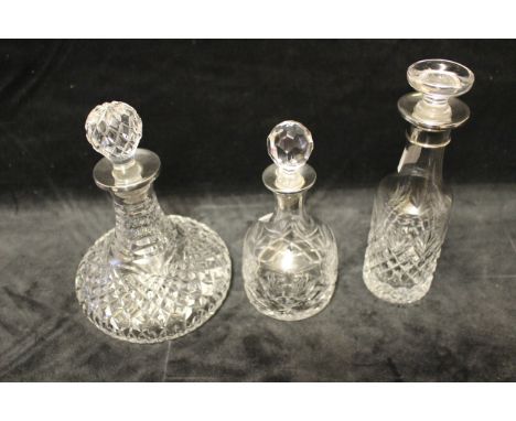 A small ship's decanter and stopper with plain silver collar, Argyll silver, Birmingham 1987, 16.5cm high, two others, one wi
