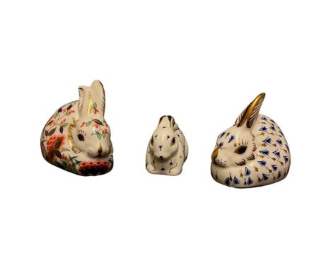 A Royal Crown Derby paperweight "Meadow Rabbit" 8.5cm long and two others 8.5cm long and 6.5cm long (3)