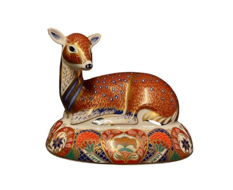 A Royal Crown Derby paperweight, recumbent deer designed for the Derby Collector's Guild, 16cm wide