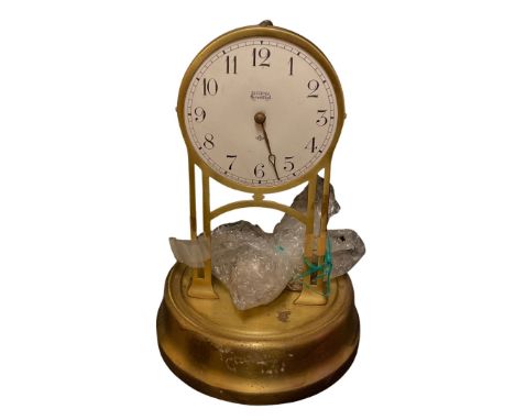 A Tiffany Neverwind brass mantel clock, 26cm high condition: lacking glass dome