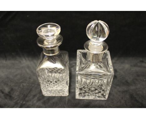 A cut glass small decanter and stopper with plain silver collar, Charles S Green, Birmingham 1986, 15cm high another W.I.Broa
