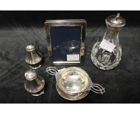 A silver rectangular small easel photograph frame, Carrs, Sheffield 1991, a silver mounted angostura bitters small decanter, 