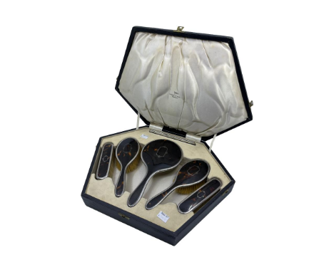 Sterling Silver Tortoiseshell Six Piece Vanity Dressing Table Set in Original Box.  The Set consists of a Mirror, Four Brushe