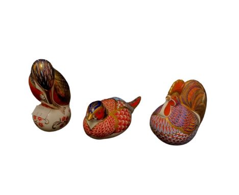 A Royal Crown Derby paperweight, 11.5cm high, a Royal Crown Derby Cockerel paperweight, 10cm high and a Royal Crown Derby par