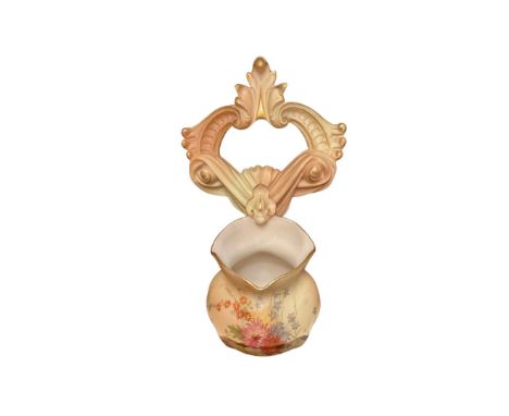 A late 19th century Royal Worcester blush ivory wall pocket painted with flower sprays modelled as a posy bowl supported by s