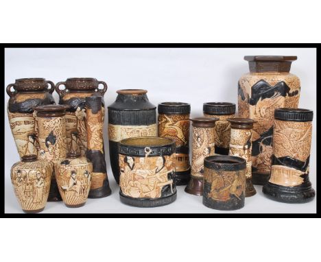 A selection of late 19th Century / early 20th Century Bretby Japaned / Japanese style ceramic vases having embossed narrative