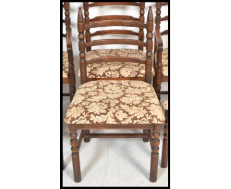 A set of six 20th Century oak ladder back dining chairs possibly by Jaycee furniture, over stuffed drop in seats upholstered 