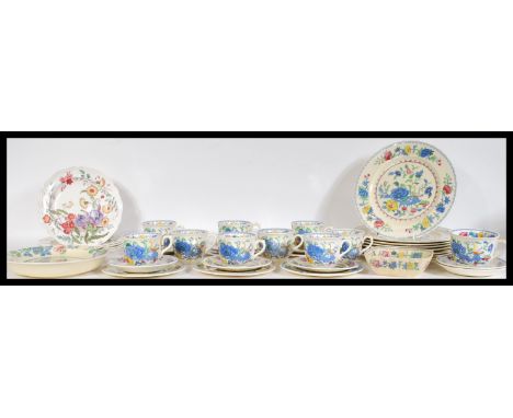 A Mason's part dinner / tea service in the Regency pattern having printed blue floral sprays to include one warming plate, on