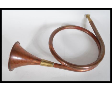Hunting interest -A vintage early 20th Century copper and brass single coil&nbsp; hunting horn / bugle of shaped form with br