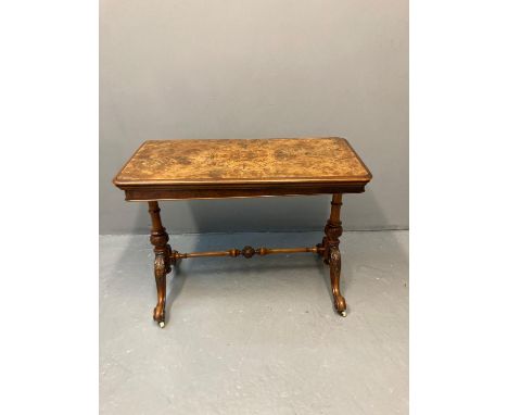 Victorian walnut stretcher folding card table, the moulded hinged lid revealing green baize with swivel mechanism, standing o