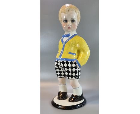 Large Art Deco Lenci ceramic figure of a boy, designed by Sandro Vacchetti, wearing a yellow and blue cardigan with black che