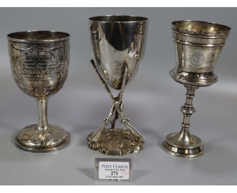 Three silver and silver plate trophy cups to include: vine leaf repousse decorated cup presented by the committee of Commandi