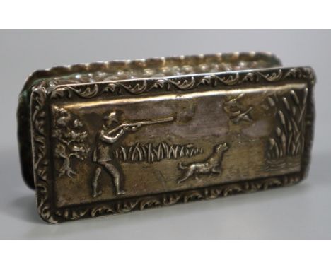 19th Century silver repousse decorated sporting snuff box of rectangular form, decorated with a shooting scene to the hinged 