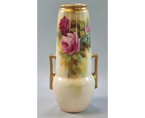 Royal Worcester porcelain two handled vase, the body decorated with roses and foliage, having gilded handles. Puce marks to t