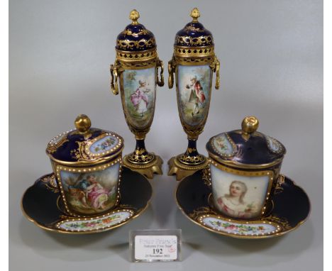Pair of early 20th Century Sevres porcelain hot chocolate cups, covers and saucers, on a cobalt blue and gilded ground with, 