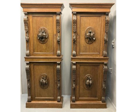 Pair of late Victorian mahogany cabinets, the moulded cornices above carved and moulded central panel to the door of dead gam