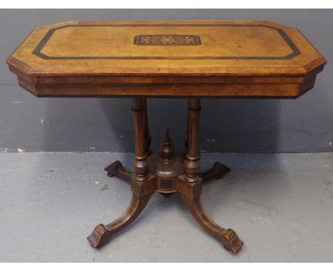 Victorian walnut and mixed woods inlaid octagonal card/games table, the hinged lid revealing a red baize, standing on quatref