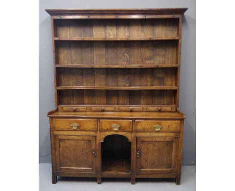 19th Century oak two stage rack back dog kennel dresser, the moulded cornice above boarded rack with three fitted shelves and