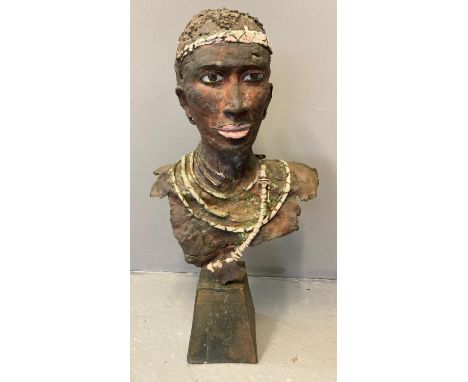 African hollow ceramic bust of a beaded chieftain, with metal armature on loaded base. 87cm high approx. (B.P. 21% + VAT) Som