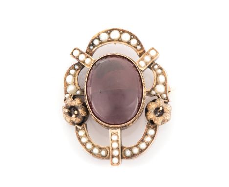 AN AMETHYST AND PEARL BROOCH the oval amethyst cabochon measuring approximately 22mm x 17mm tube-set and surrounded by half s