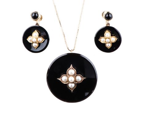 A BLACK ENAMEL AND SEED PEARL EARRING AND PENDANT SET the large round enamel discs centred by a ﬂower in 14k yellow gold and 