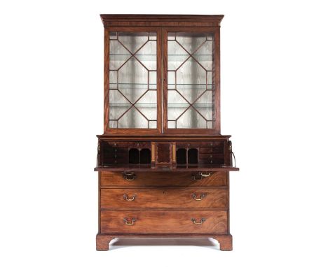 A GEORGE III MAHOGANY SECRÉTAIRE BOOKCASE in two parts, the outswept cornice above a pair of astragal glazed doors enclosing 
