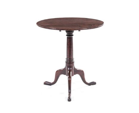 A GEORGE III TILT-TOP TRIPOD OCCASIONAL TABLE the circular top on a tapering turned support, on hipped outswept legs, on pad 