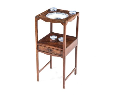A GEORGE III MAHOGANY WASHSTAND the moulded square top centred by a circular aperture flanked by two smaller apertures, an op
