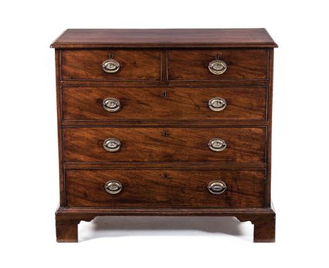 A GEORGE III MAHOGANY CHEST OF DRAWERS the rectangular moulded crossbanded top above a pair of short cockbeaded frieze drawer