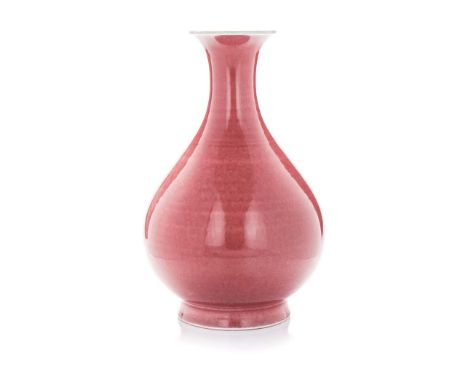 A CHINESE COPPER-RED PEAR-SHAPED VASE, ‘YUHUCHUNPING’ the pear-shaped body rising to a narrow neck and flaring mouth rim, all