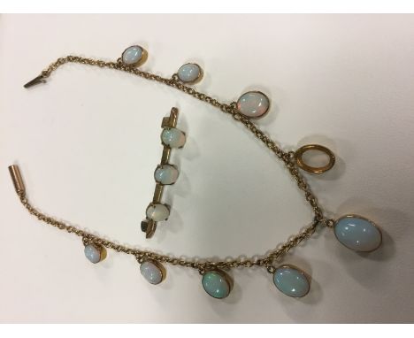 A gold coloured bracelet set with eight opals together with a 9ct gold three stone opal set bar brooch (2)