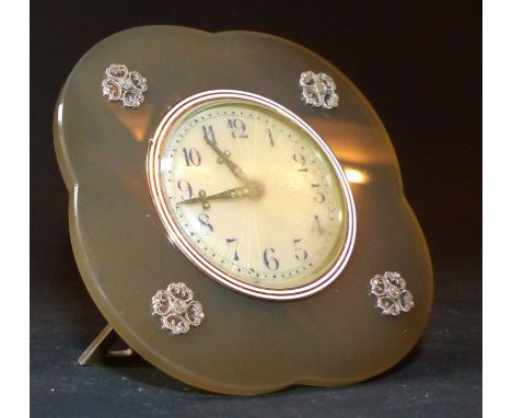 In the manner of Cartier, a circa 1920's desk clock with polished agate surround inset with four rose cut diamond bosses, the