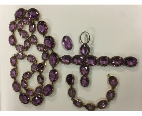 A 19th Century amethyst paste set cross pendant on necklace, approximately 33cm long together with a part matching bracelet (