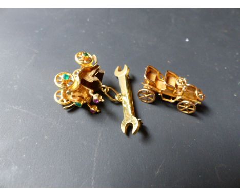 A 750 standard gold coloured motor car chain gem set with spanner bar brooch, bears date 1902 together with a gold coloured m