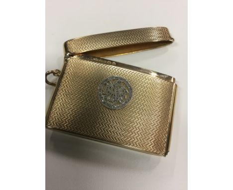 A 9ct gold engine turned vesta case with rose cut diamond monogram. P.S.M dated Birmingham 1923. 41grams